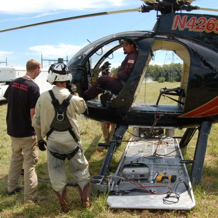 Helicopter installation of Transmission Line Conductor Monitor ...